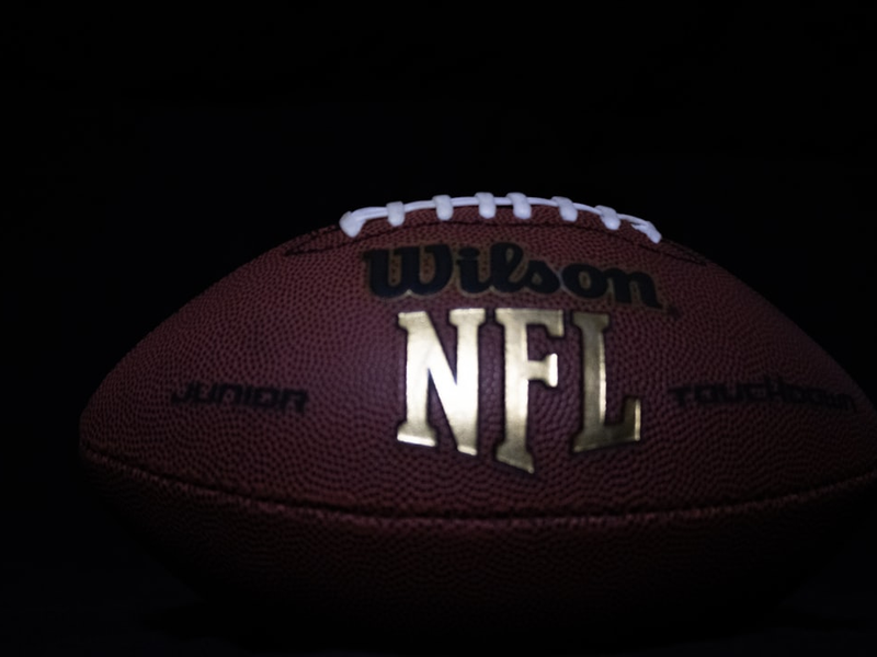 a close up of a football on a black background