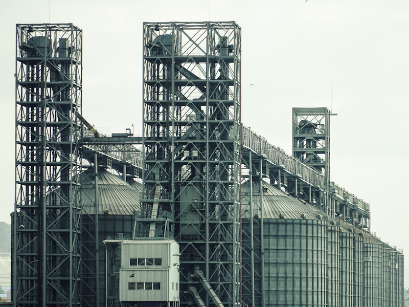 a large industrial building with a lot of pipes