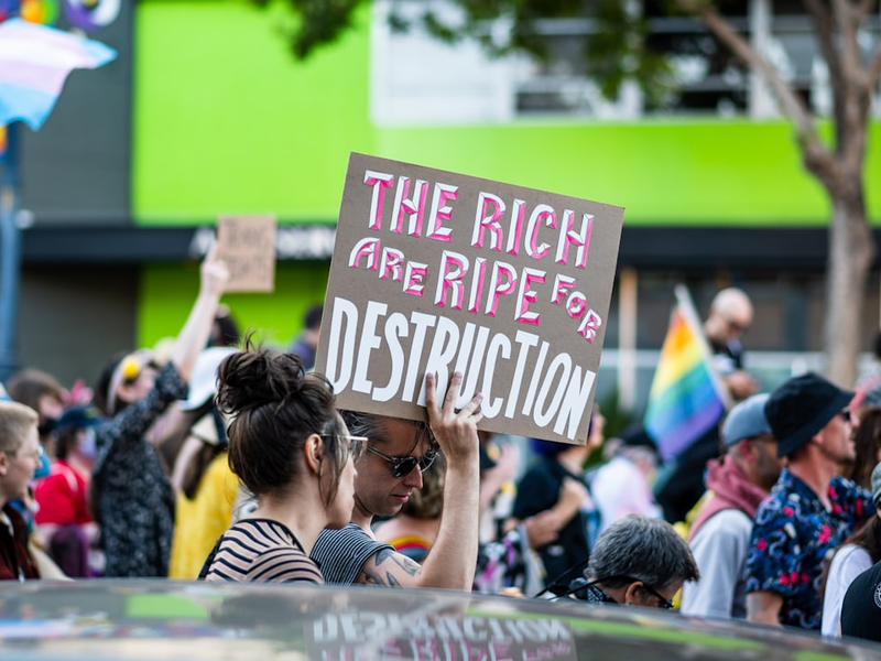 a group of people holding signs