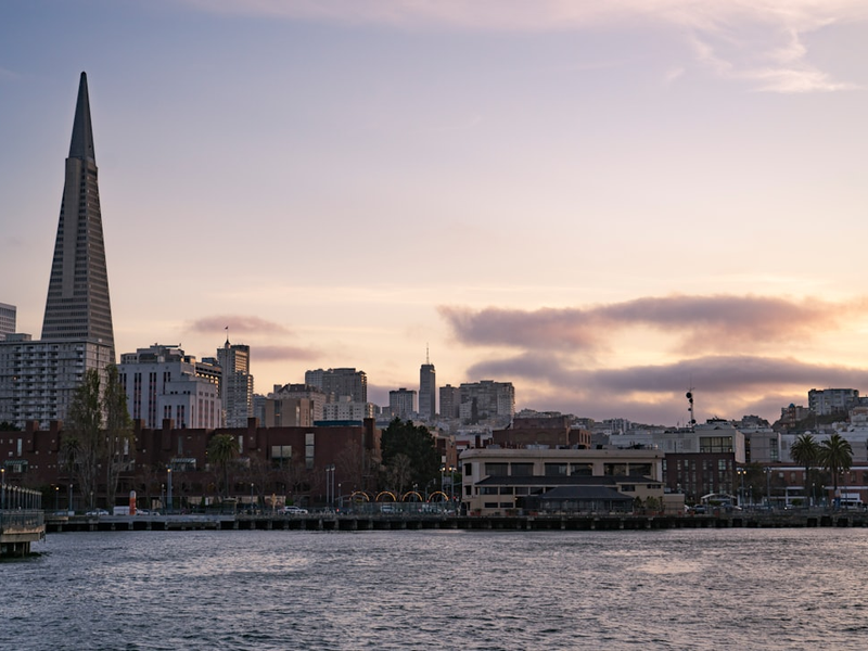 A large body of water with a city in the background