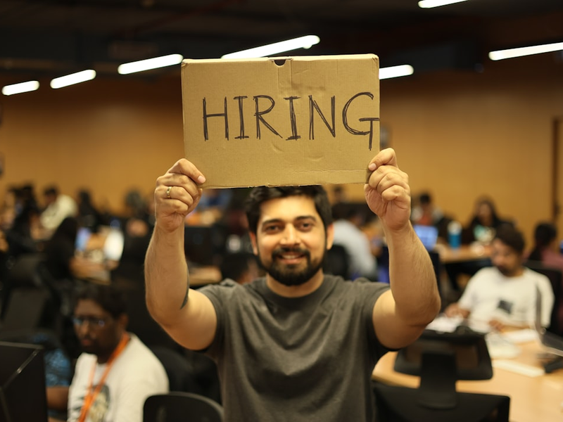 a man holding a sign