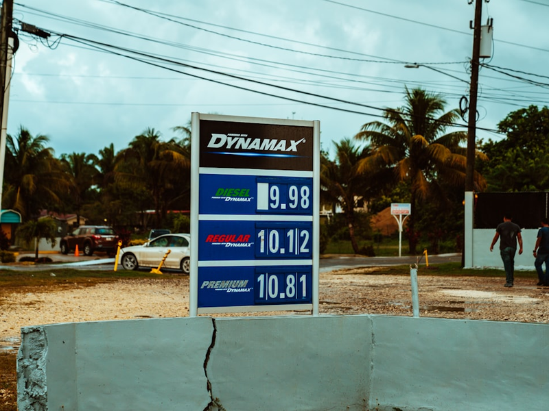 Petrol prices on a sign at Dynamax gas station.