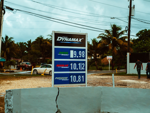 Petrol prices on a sign at Dynamax gas station.