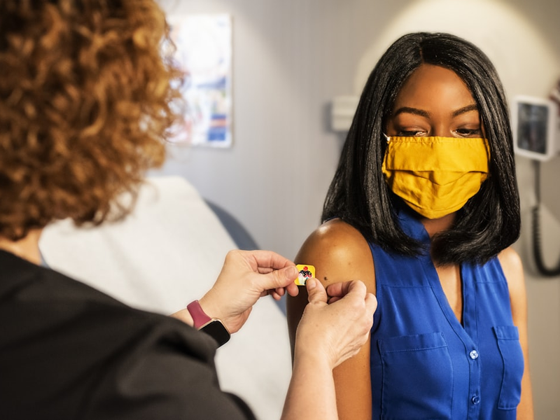 In this 2020 photograph, captured inside a clinical setting, a health care provider and patient, consult on influenza vaccine options. The best way to prevent seasonal flu illness is to get vaccinated every year. Centers for Disease Control and Prevention (CDC) recommends everyone 6-months of age and older get a flu vaccine every season. There are many vaccine options to choose from, but the most important thing, is for all people 6-months and older, get an influenza vaccine every year.