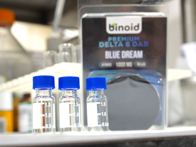 three bottles of blue dream sitting on a shelf