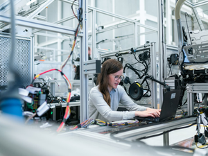 Female electronics engineer runs vehicle tests
