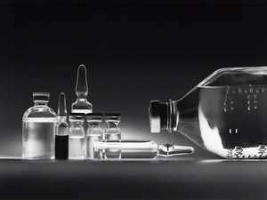 Variety of chemotherapy drugs in vials and an IV bottle.