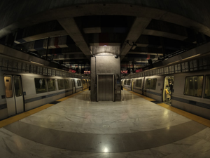 A subway station with two trains parked in it