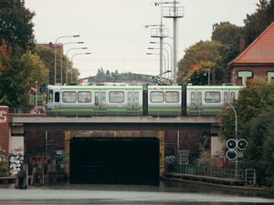 a train traveling over a bridge over a river