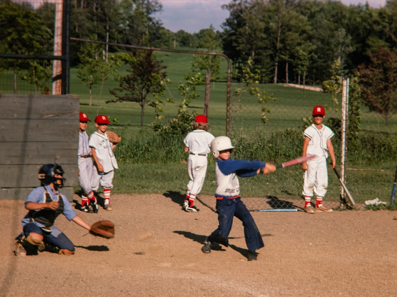 a group of young men playing a game of baseball