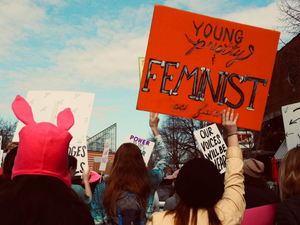 a group of people holding signs
