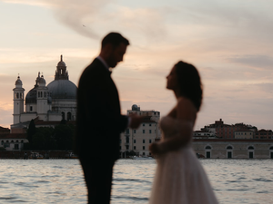 The beautiful sunset over Venice was pure romance as this couple exchanged vows during their elopement.