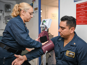 23-0042-035 (7988384) Boxer Medical Maintains Sailor Health Readiness 08.23.2023 Photo by Petty Officer 2nd Class James Finney USS Boxer (LHD 4) Hospital Corpsman 3rd Class Andreana Franco, a native of San Francisco, takes vital sign readings from Chief Fire Controlman Adolfo Macias, a native of Bell Gardens, California, in the ship’s dental space aboard USS Boxer (LHD 4), Aug. 23, 2023. Boxer is a Wasp-class amphibious assault ship currently underway in the U.S. 3rd Fleet area of operations. (U.S. Navy photo by Mass Communication Specialist 2nd Class James Finney) [blood pressure]