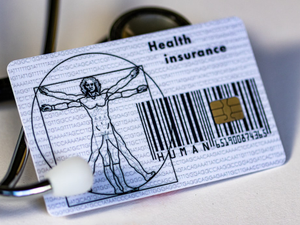a health card and a stethoscope