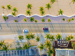 Aerial Drone View: White Autonomous Self Driving Car Moving Through City. Concept: Artificial Intelligence Scans Surrounding Environment, Detecting Cars, Avoids Traffic Jams and Drives Safely.