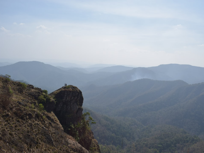 a view of the mountains from a high cliff