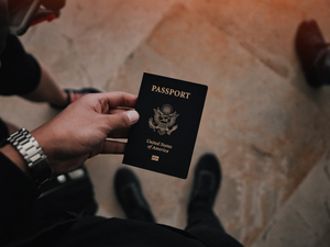 person holding passport
