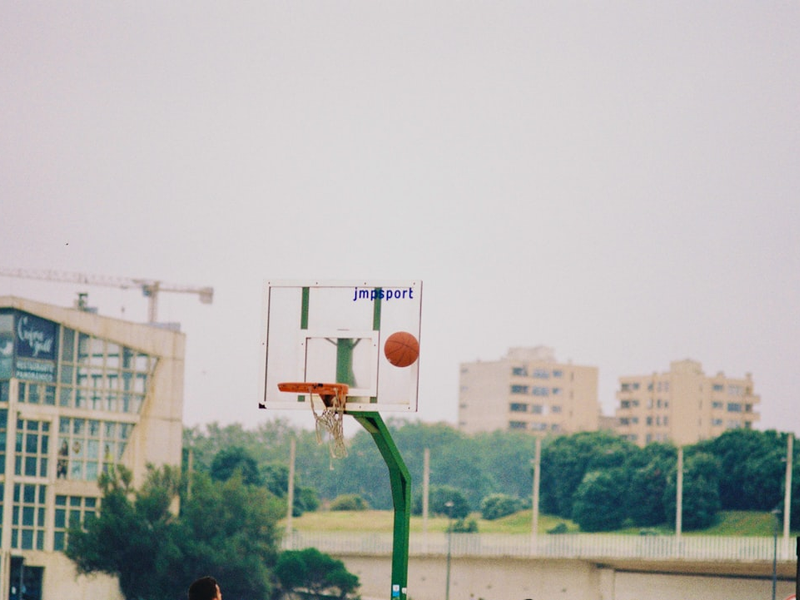 basketball hoop with green metal stand