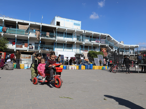 Children are playing despite the shelling and destruction in one of the UNRWA shelters.
