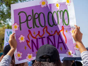 a group of people holding up a sign