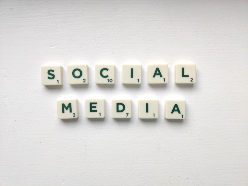 Social media worlds on the white table. Want to know more about social media marketing? Read on: www.hookle.net/post/what-is-social-media-marketing-and-why-is-it-important-for-small-businesses