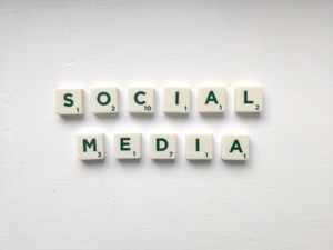 Social media worlds on the white table. Want to know more about social media marketing? Read on: www.hookle.net/post/what-is-social-media-marketing-and-why-is-it-important-for-small-businesses