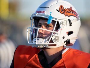 person in blue and white helmet and red and black jersey shirt
