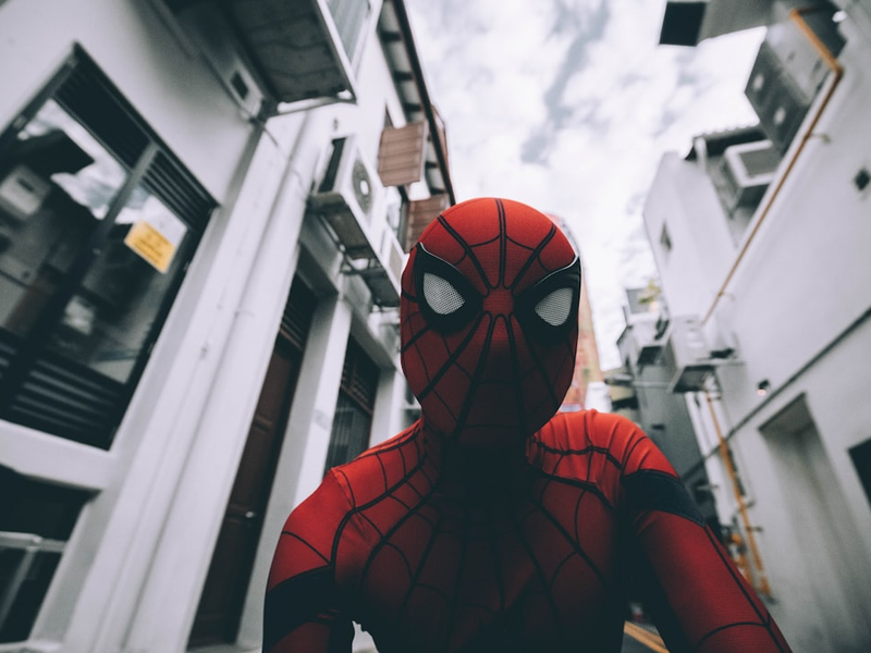 Spider-Man standing in the middle of buildings