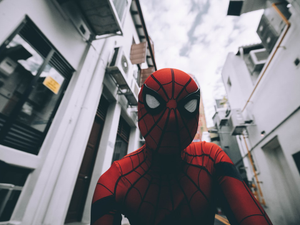 Spider-Man standing in the middle of buildings