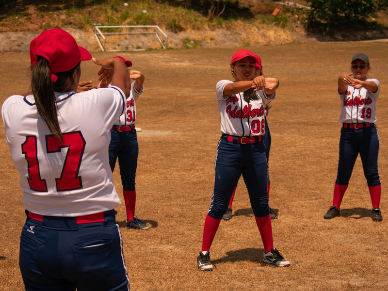 Women getting ready to play an amateur softball game. Laguna de San Carlos, Panama.