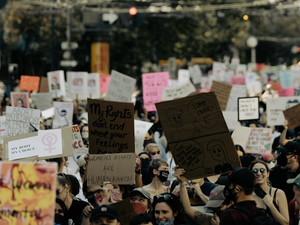 a large group of people holding up signs