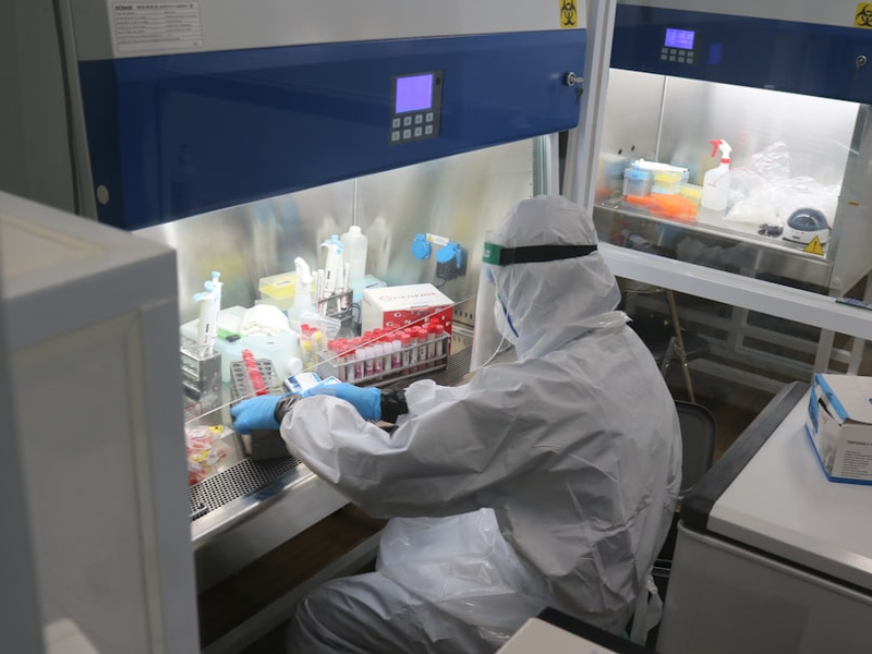 a laboratory worker is using a pcr swab in a hospital