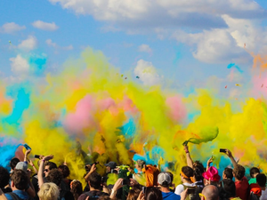 group of people celebrating powder festival outdoors