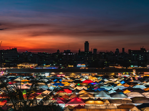 a large group of tents are lit up at night