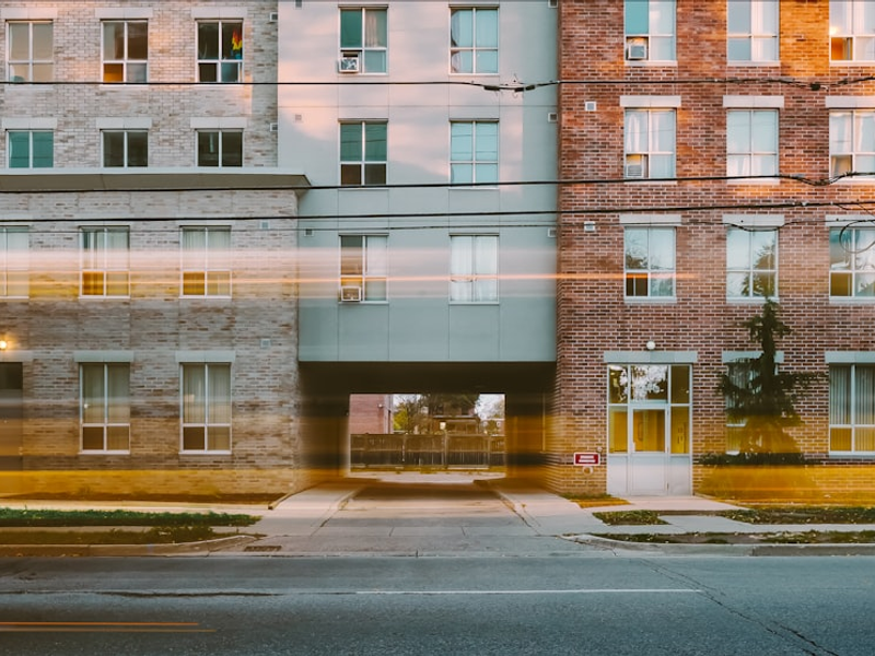 School bus goes by LIFT, affordable housing, in downtown London Ontario - King Street.