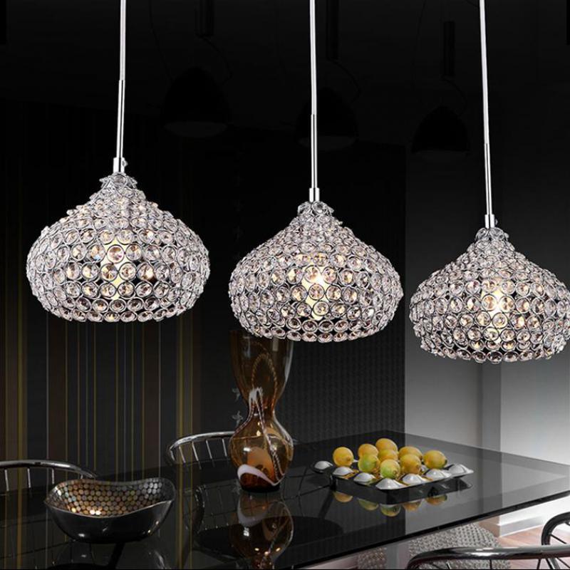 crystal pendant lights hang over a modern
