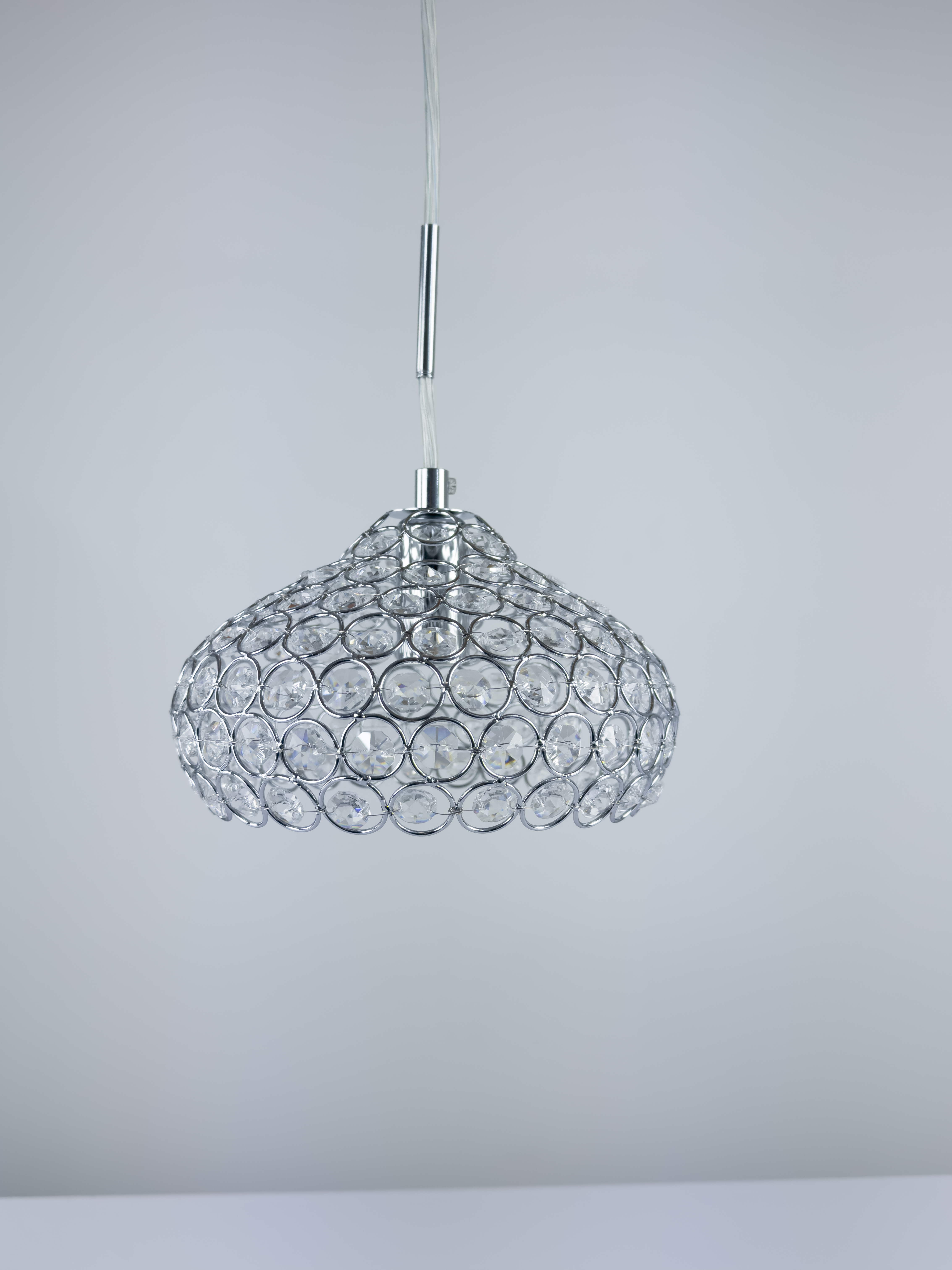 crystal pendant lights hang over a modern