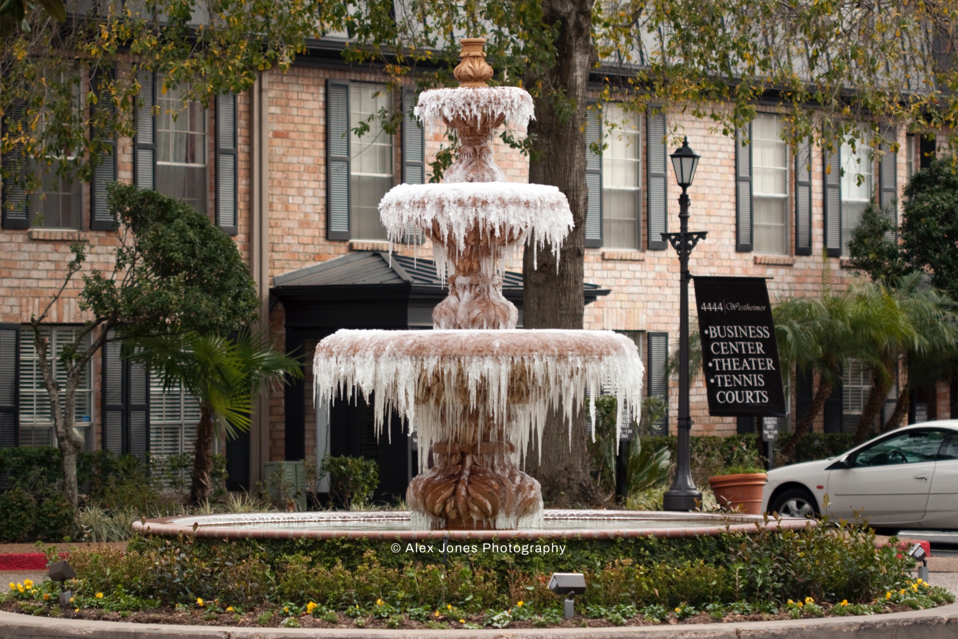 This fountain has water flowing down from the top through three different levels.