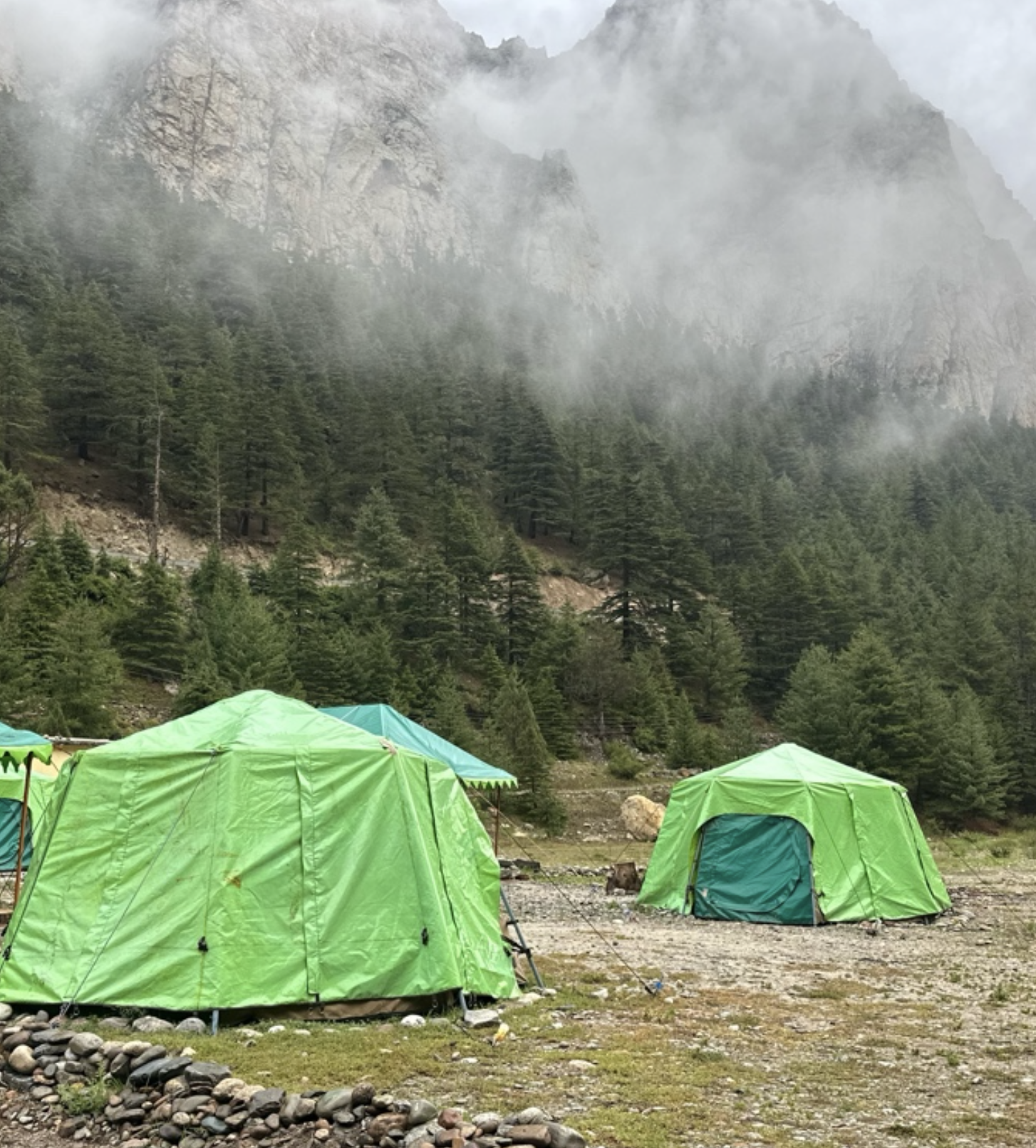 Adventure tent setup in mountain wilderness