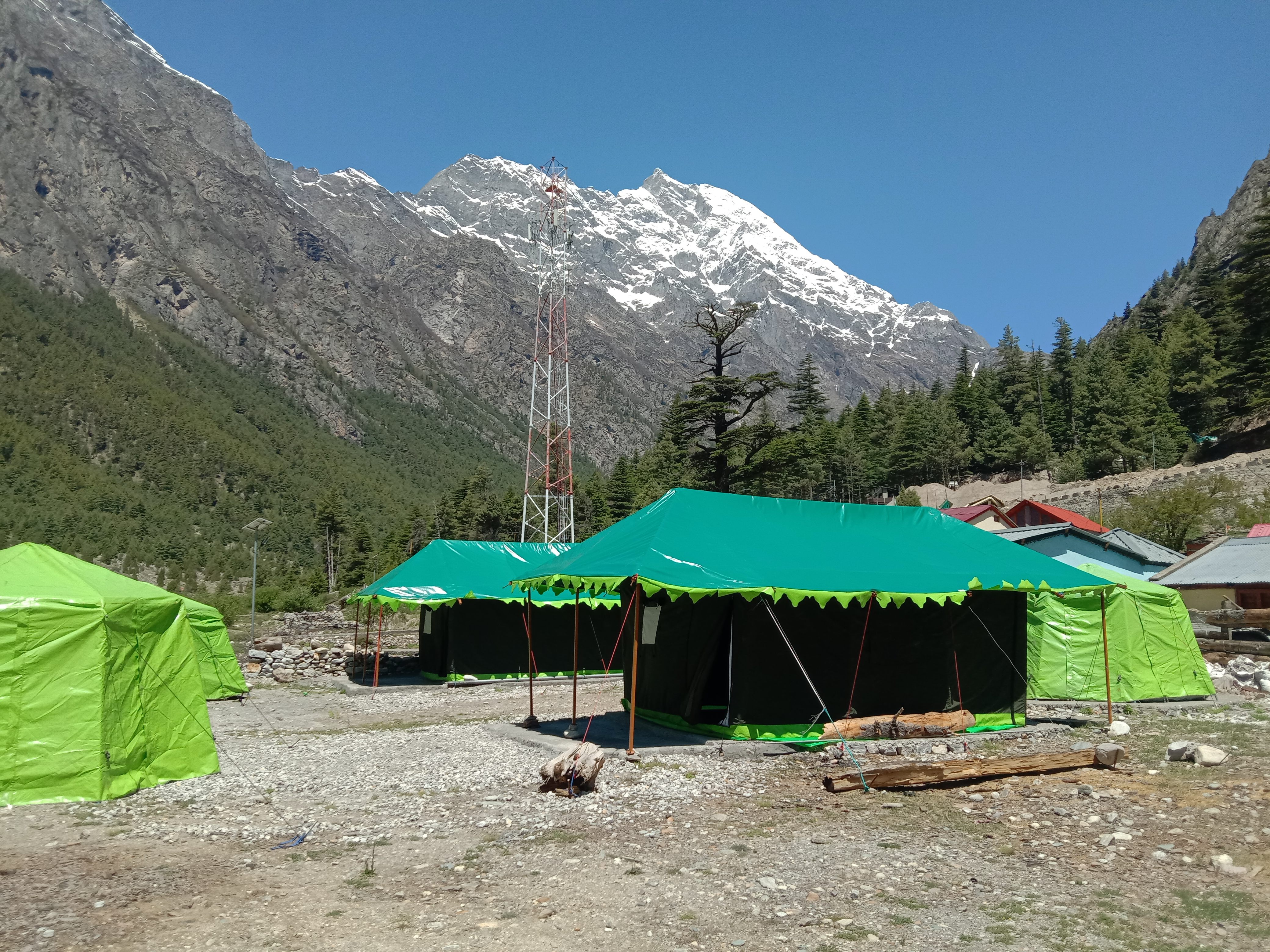 Swiss tents with mountain backdrop