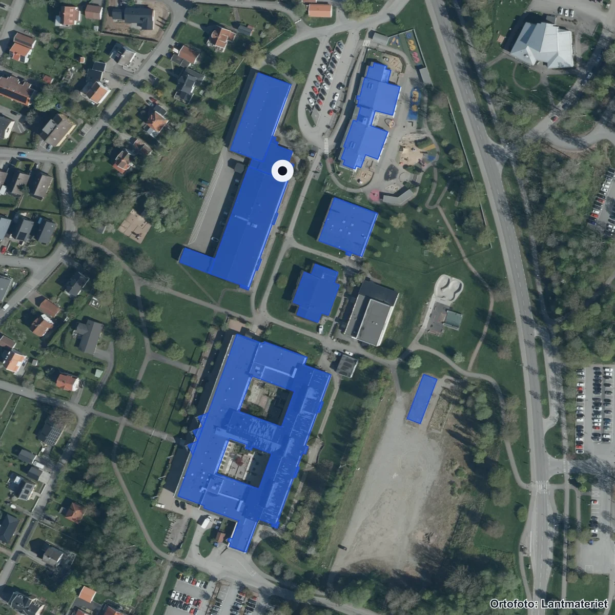 Flygbild över Tingsholmsgymnasiet, ortofoto från Lantmäteriet