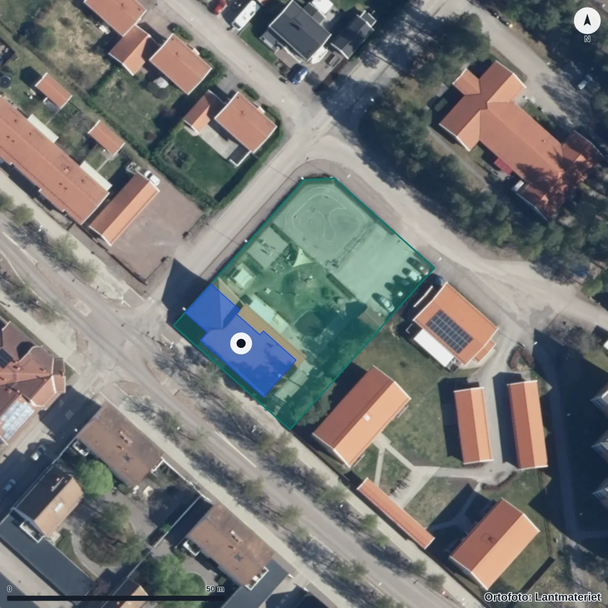 Flygbild över Förskolan Guldgruvan Gruvriset, ortofoto från Lantmäteriet