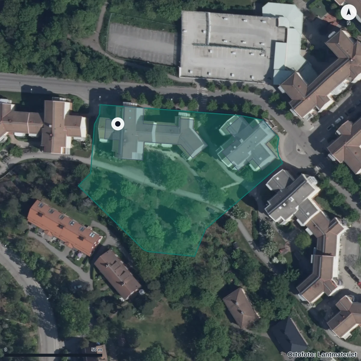 Flygbild över Förskolan Minne Mus Montessoriförskola, ortofoto från Lantmäteriet