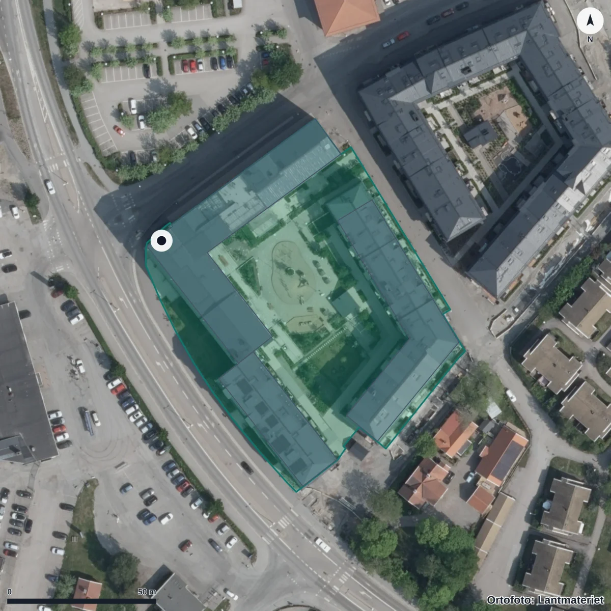 Flygbild över Norlandia Förskolor Rospiggen, ortofoto från Lantmäteriet