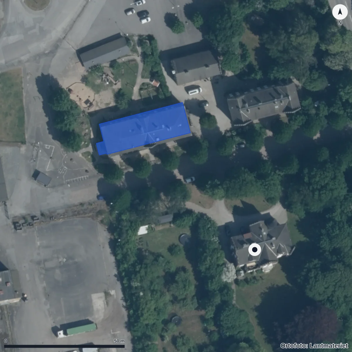 Flygbild över Kyrkans Förskola Stjärnan, ortofoto från Lantmäteriet