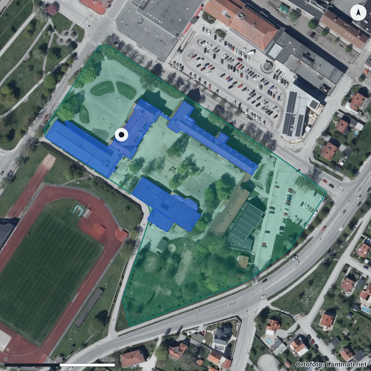 Flygbild över Solberga anpassad grundskola, ortofoto från Lantmäteriet