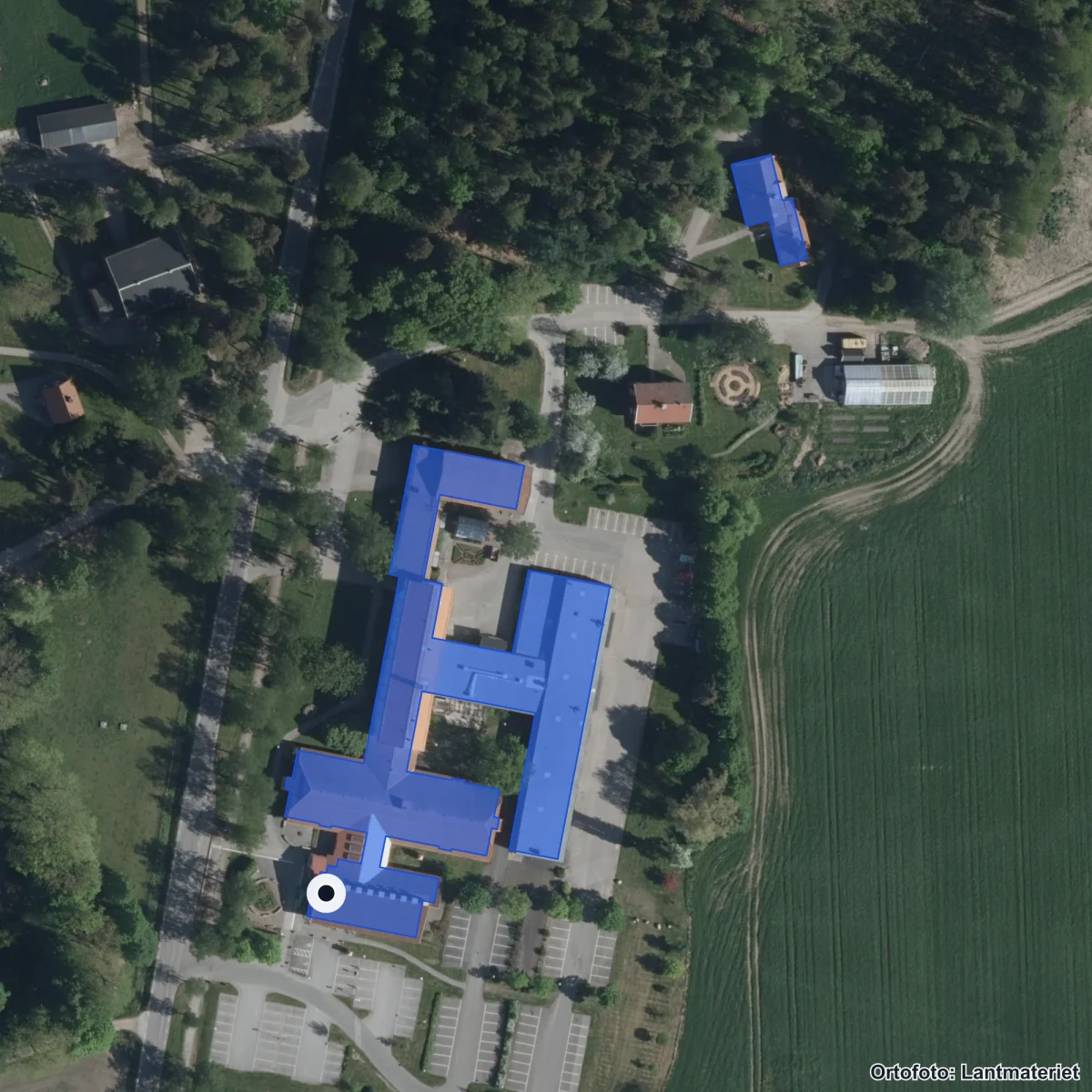 Flygbild över Naturbruksskolan Uddetorp, ortofoto från Lantmäteriet