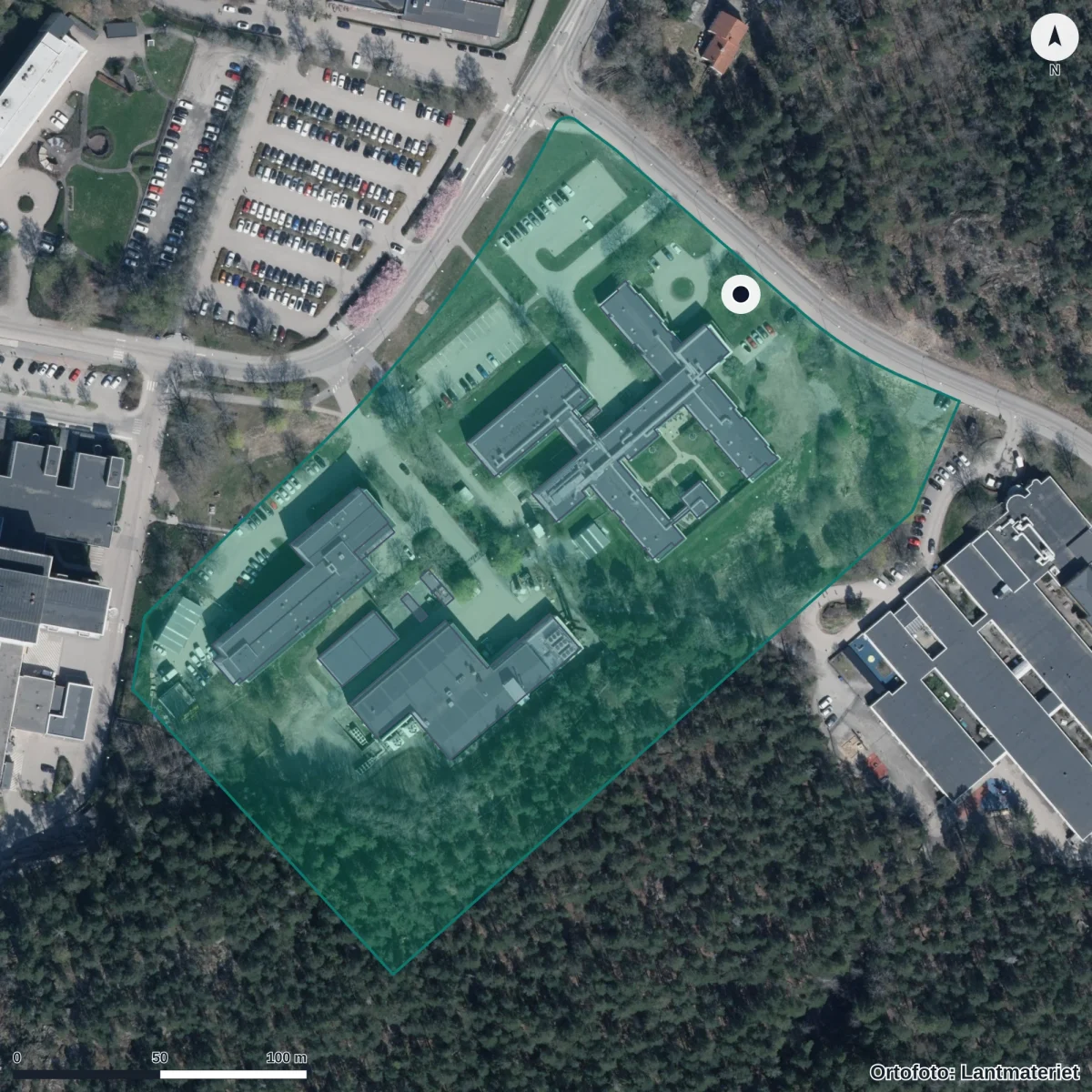 Flygbild över Anpassad grundskola Odlaren 2, ortofoto från Lantmäteriet