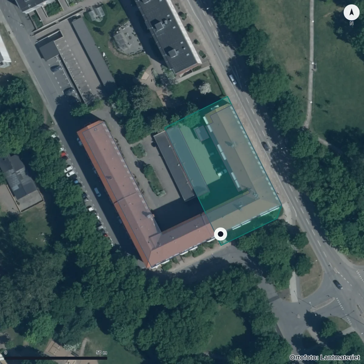 Flygbild över Dibber Stattena Montessoriförskola, ortofoto från Lantmäteriet