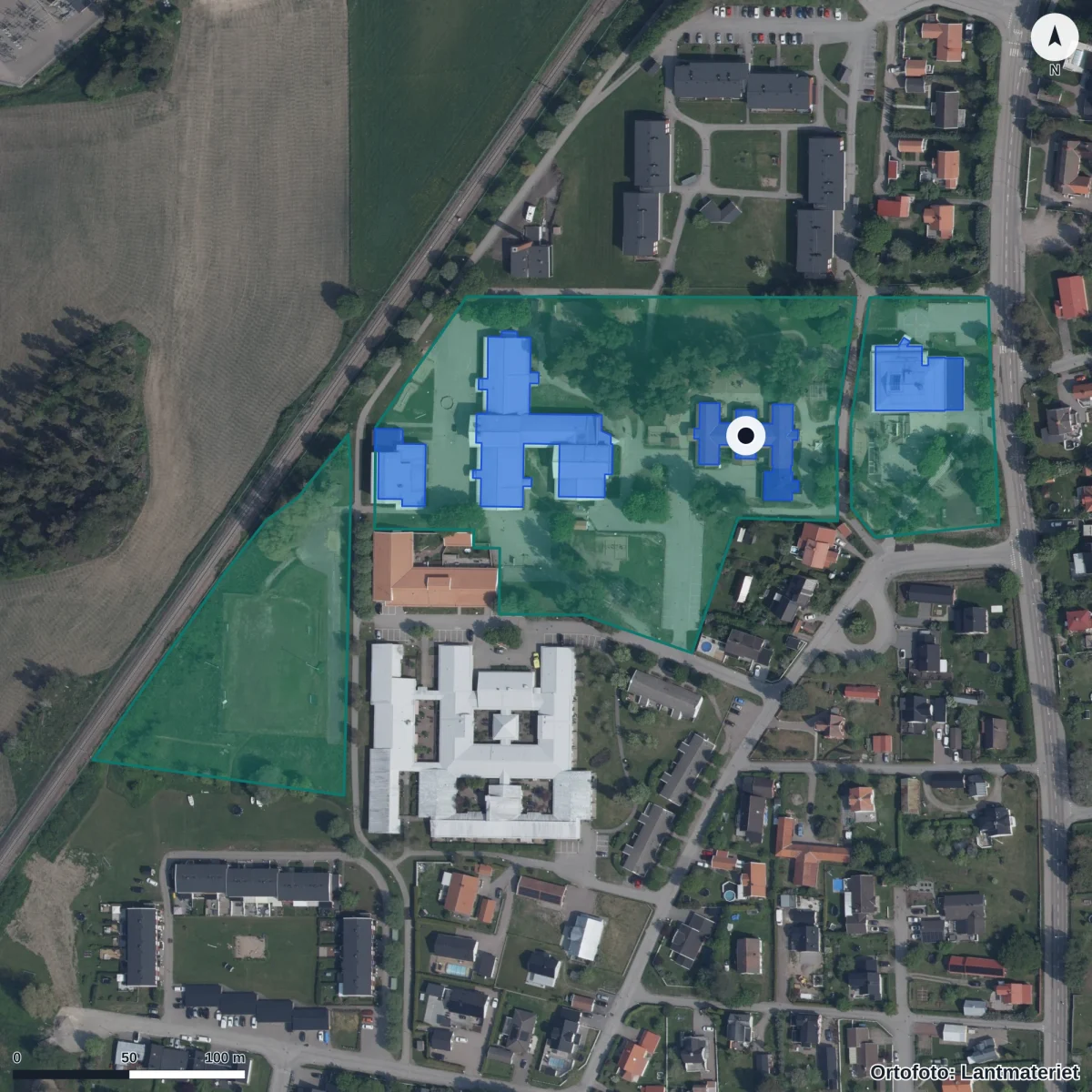 Flygbild över Milbogården, ortofoto från Lantmäteriet